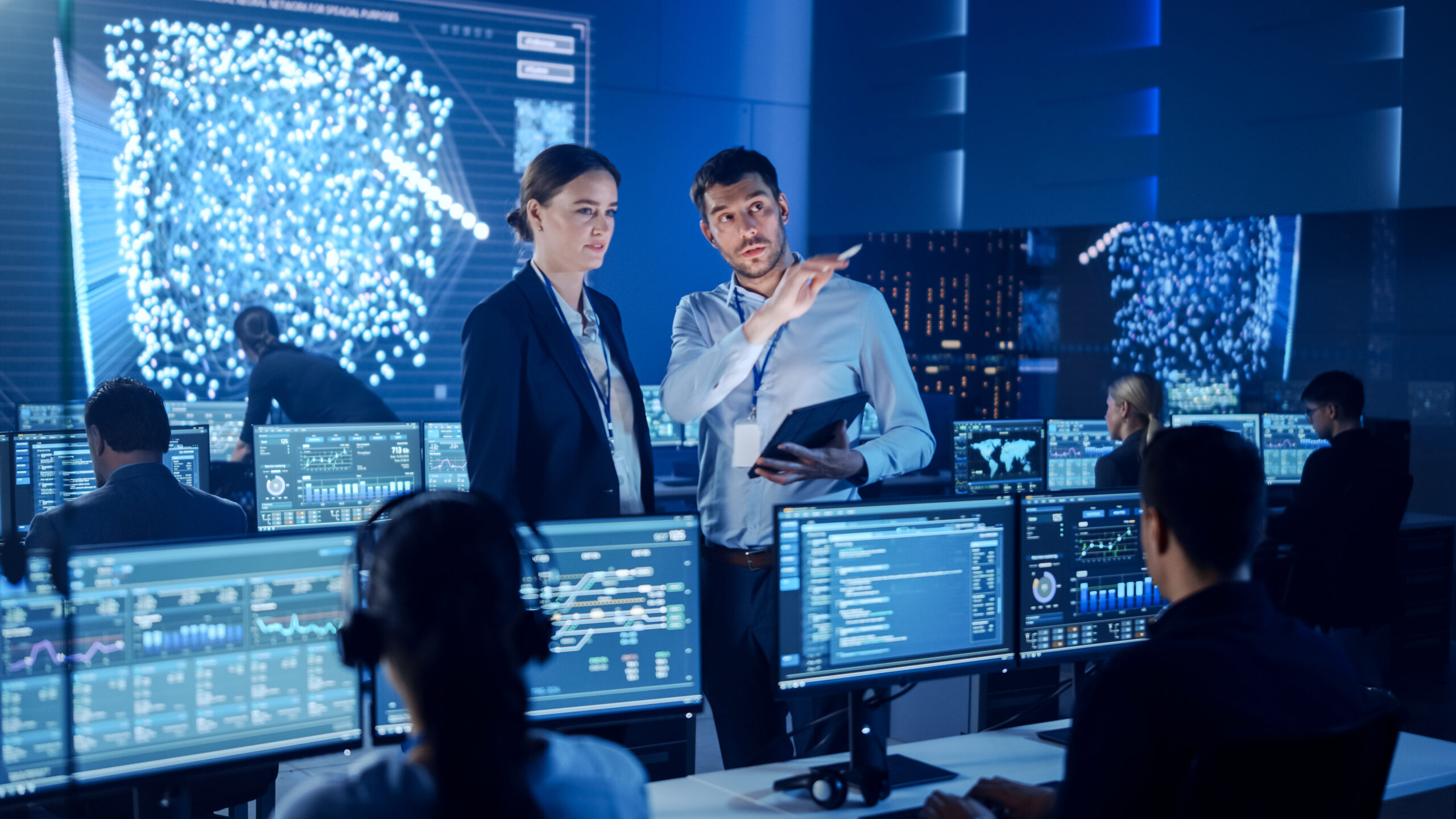 Project,Manager,And,Computer,Science,Engineer,Talking,While,Using,A