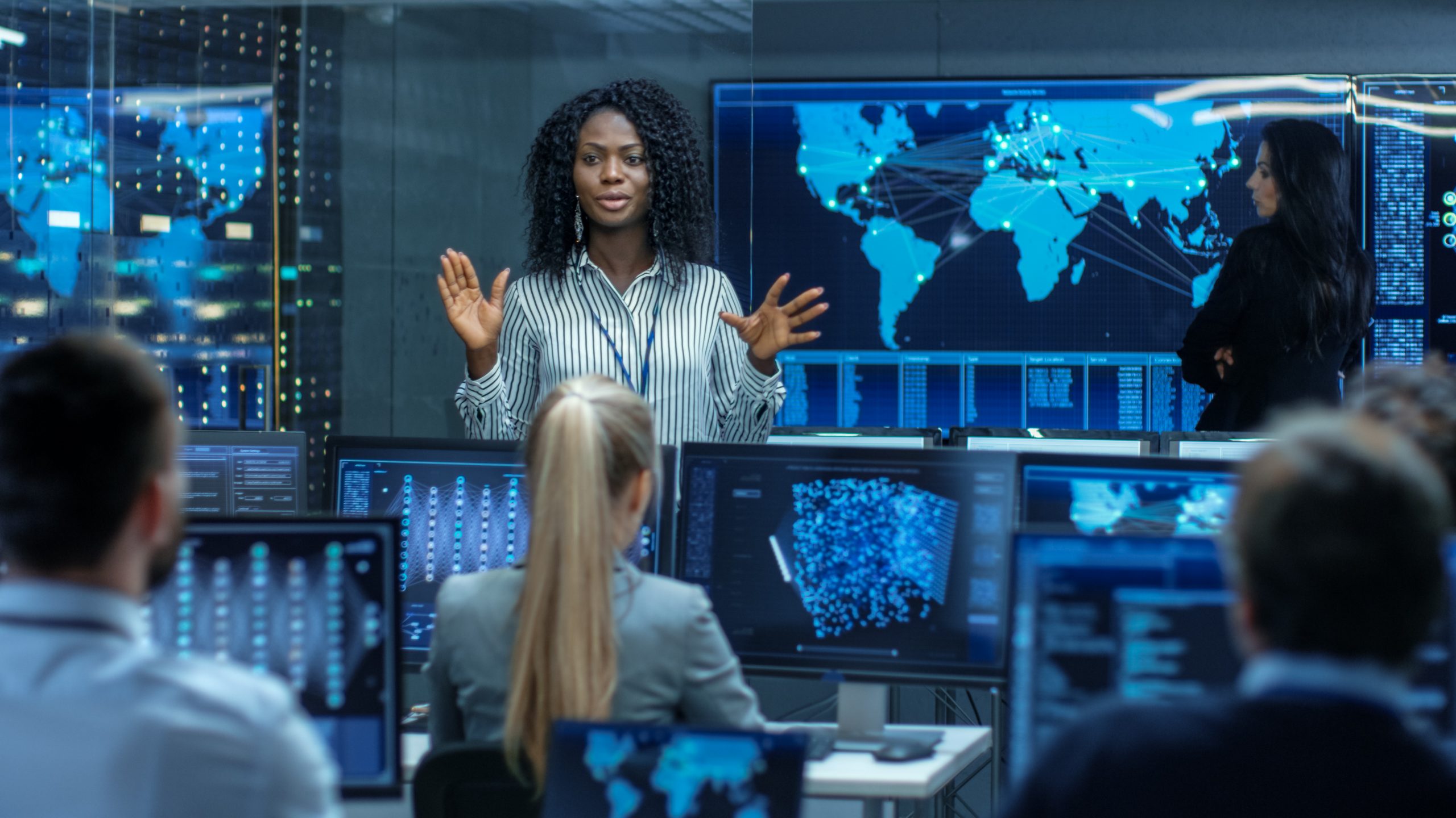 Woman monitoring for presence of cyber risks.