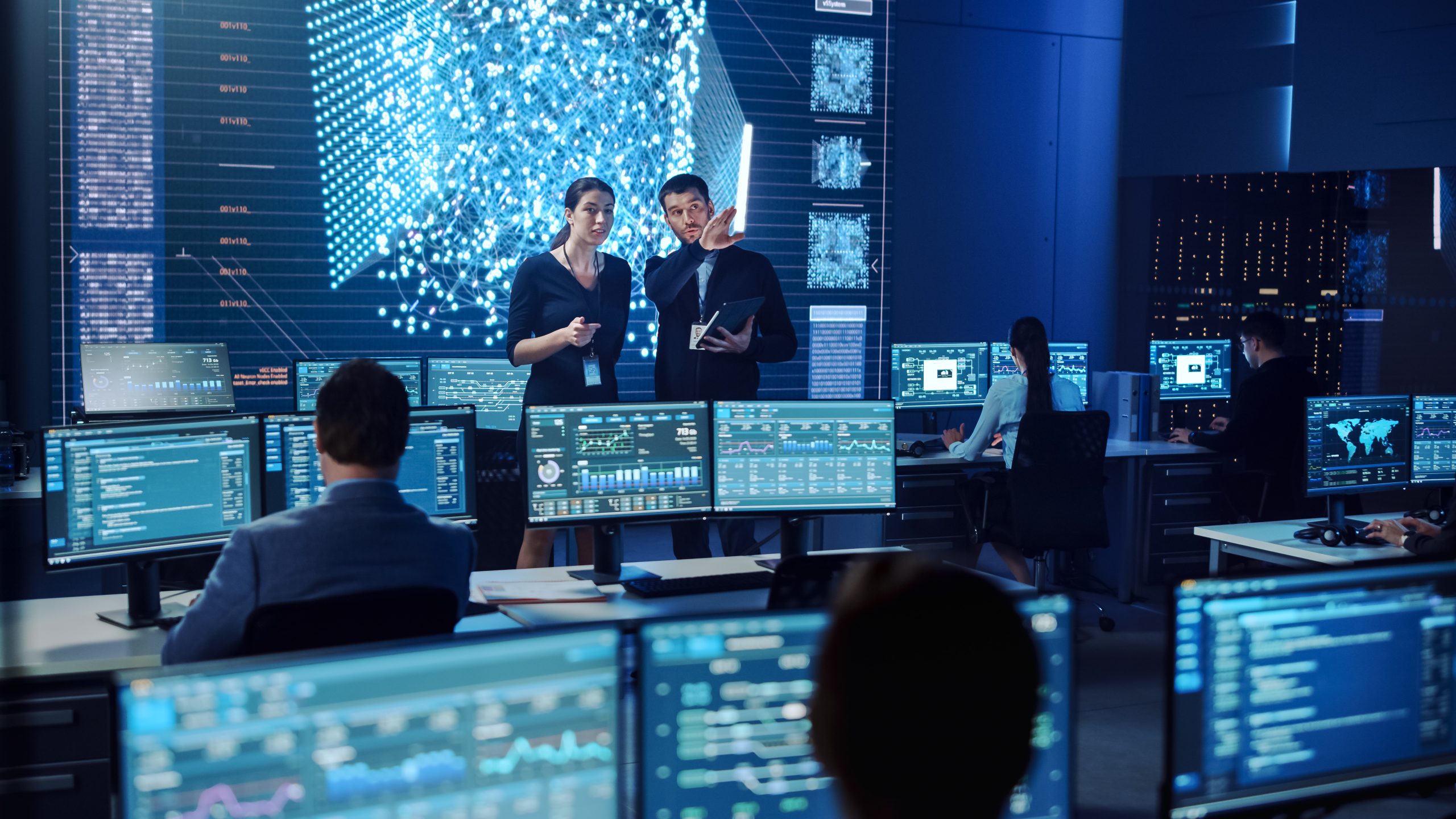 Project,Manager,And,Computer,Science,Engineer,Talking,While,Using,A